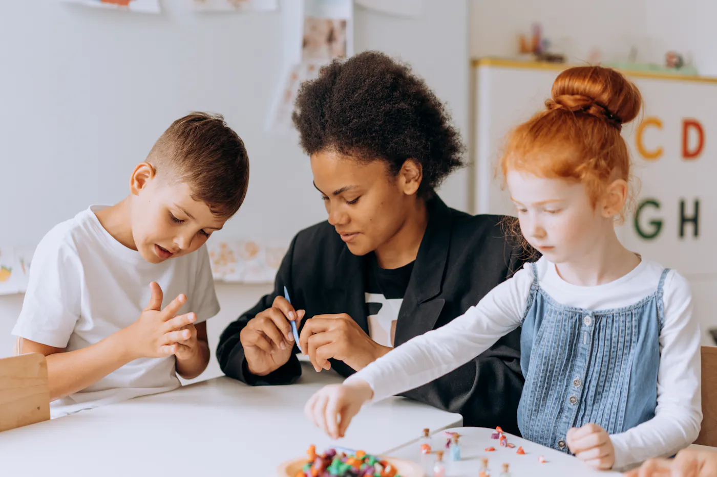 ABA therapist supporting a child during a learning activity